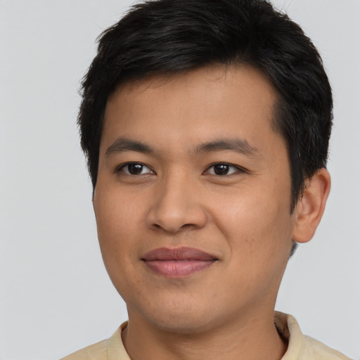 Joyful asian young-adult male with short  brown hair and brown eyes