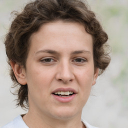 Joyful white young-adult female with medium  brown hair and green eyes