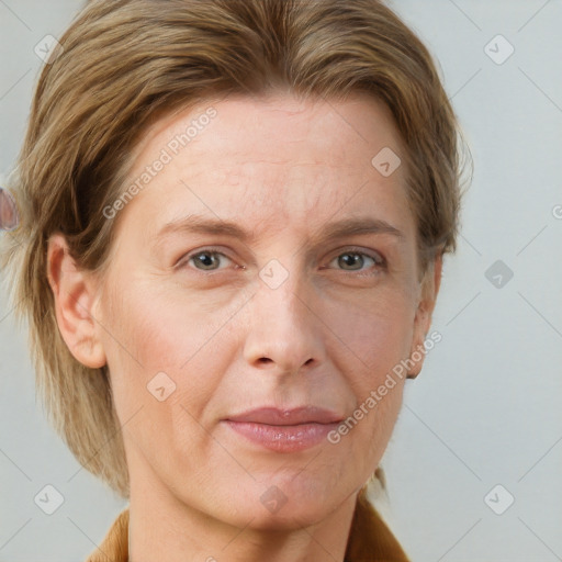 Joyful white adult female with medium  brown hair and grey eyes