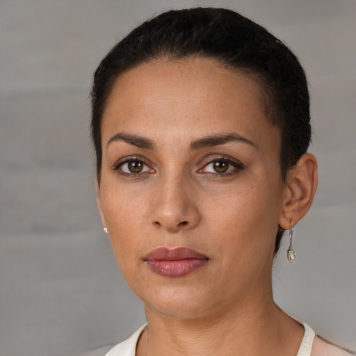 Neutral latino young-adult female with short  black hair and brown eyes
