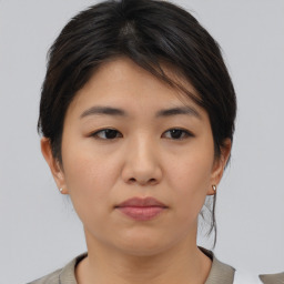 Neutral asian young-adult female with medium  brown hair and brown eyes