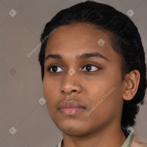 Neutral black young-adult female with short  black hair and brown eyes