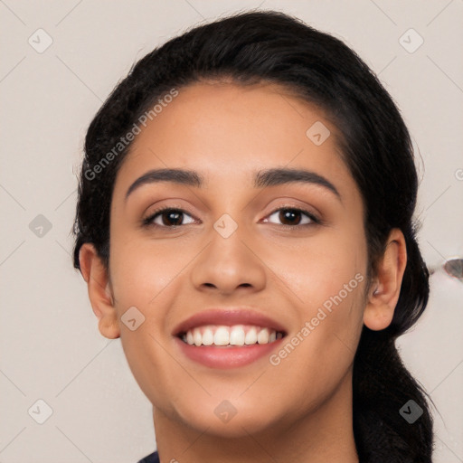 Joyful latino young-adult female with long  black hair and brown eyes