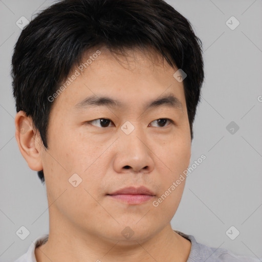 Neutral asian young-adult male with short  brown hair and brown eyes