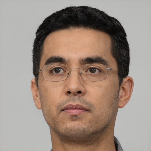 Neutral latino young-adult male with short  black hair and brown eyes