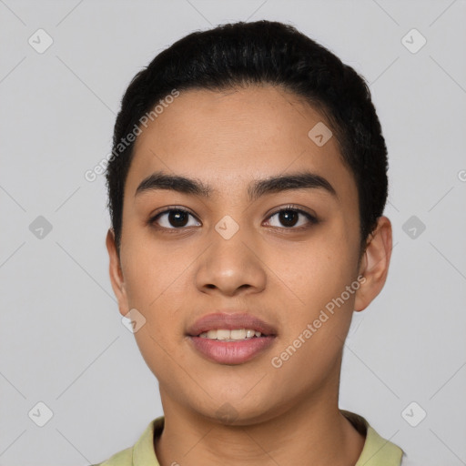 Joyful latino young-adult male with short  black hair and brown eyes