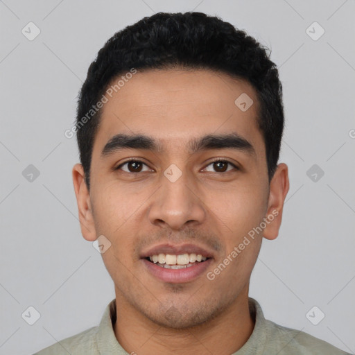 Joyful latino young-adult male with short  black hair and brown eyes