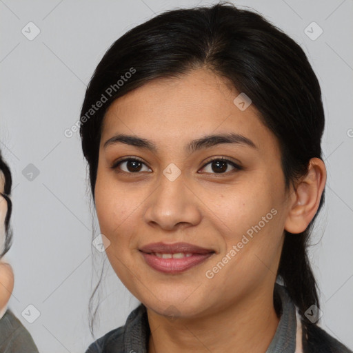 Joyful asian young-adult female with medium  black hair and brown eyes