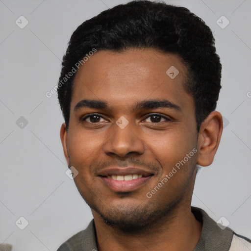 Joyful black young-adult male with short  black hair and brown eyes