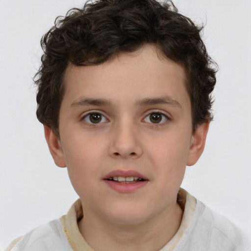 Joyful white child male with short  brown hair and brown eyes