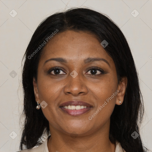 Joyful black adult female with medium  brown hair and brown eyes