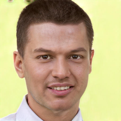 Joyful white young-adult male with short  brown hair and brown eyes