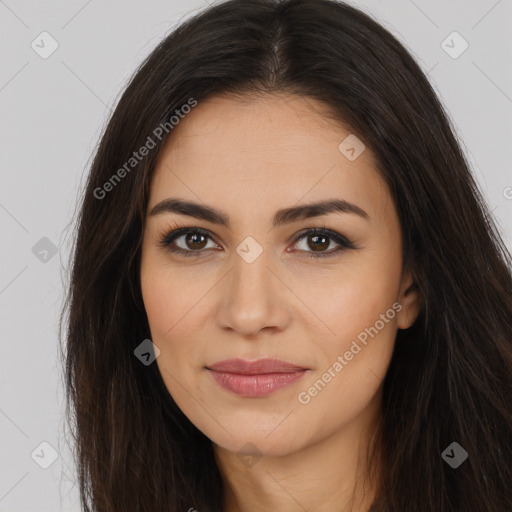 Joyful latino young-adult female with long  brown hair and brown eyes