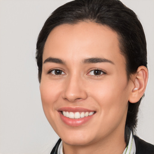 Joyful white young-adult female with medium  brown hair and brown eyes