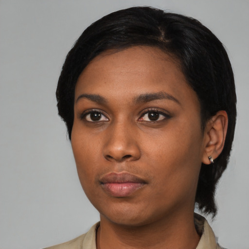 Neutral black young-adult female with medium  black hair and brown eyes