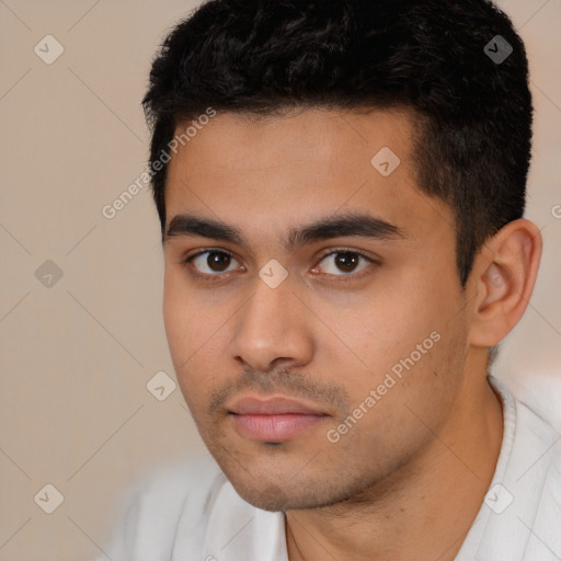 Neutral latino young-adult male with short  black hair and brown eyes