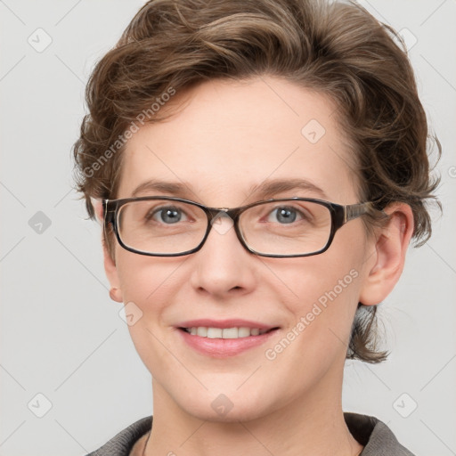 Joyful white young-adult female with short  brown hair and grey eyes