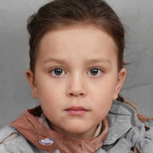 Neutral white child female with short  brown hair and blue eyes