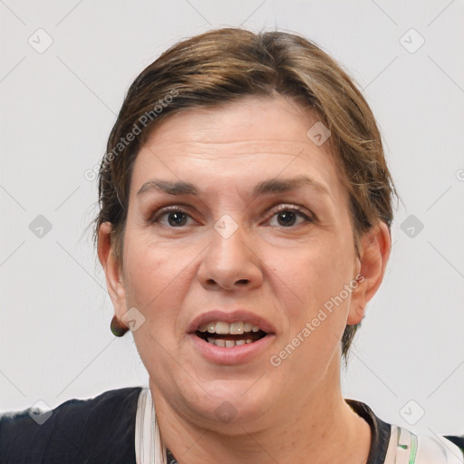 Joyful white adult female with short  brown hair and grey eyes