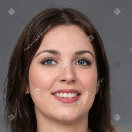 Joyful white young-adult female with long  brown hair and grey eyes