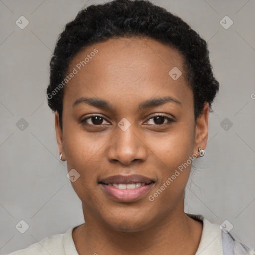 Joyful black young-adult female with short  black hair and brown eyes