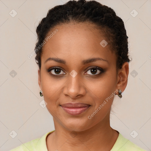 Joyful black young-adult female with short  brown hair and brown eyes