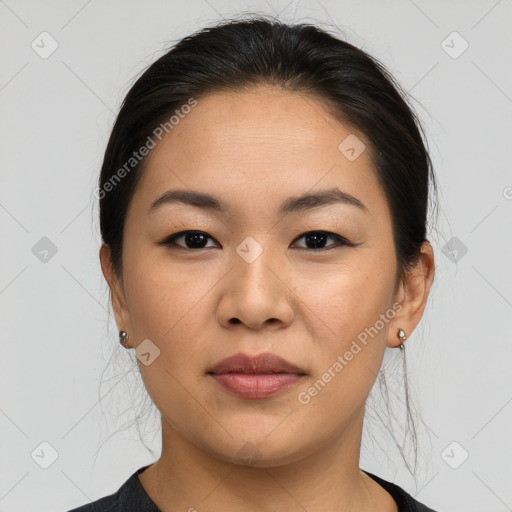 Joyful asian young-adult female with medium  brown hair and brown eyes