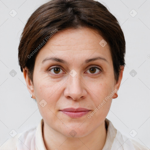 Joyful white adult female with short  brown hair and brown eyes