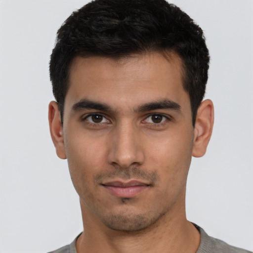 Neutral white young-adult male with short  black hair and brown eyes
