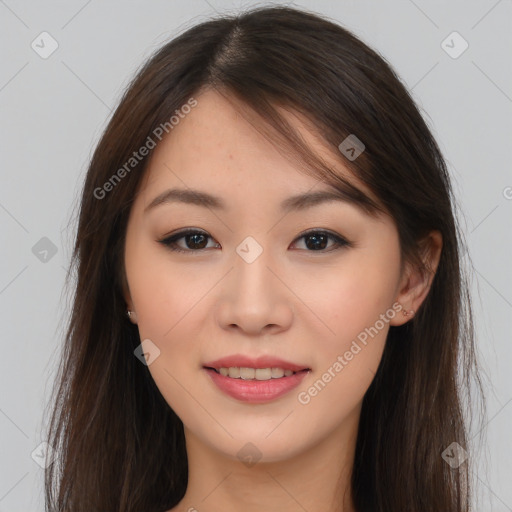 Joyful asian young-adult female with long  brown hair and brown eyes