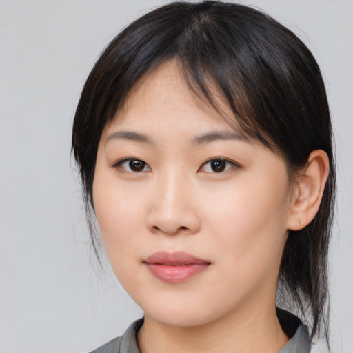 Neutral asian young-adult female with medium  brown hair and brown eyes