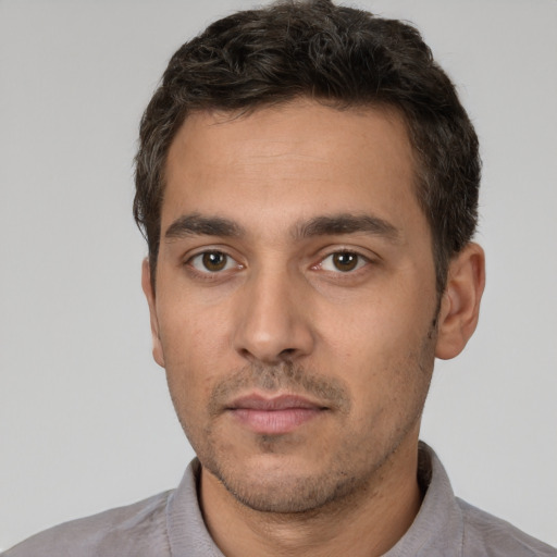 Neutral white young-adult male with short  black hair and brown eyes
