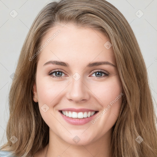 Joyful white young-adult female with long  brown hair and green eyes