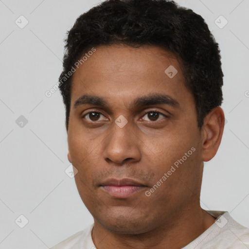 Neutral latino young-adult male with short  brown hair and brown eyes