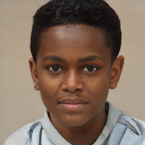 Joyful black child male with short  brown hair and brown eyes