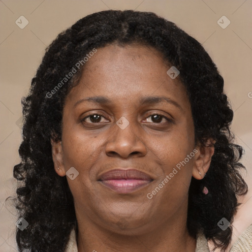 Joyful black adult female with medium  brown hair and brown eyes