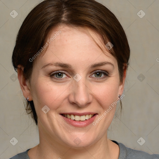 Joyful white adult female with medium  brown hair and grey eyes