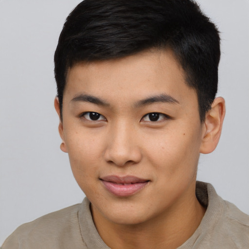 Joyful asian young-adult male with short  black hair and brown eyes