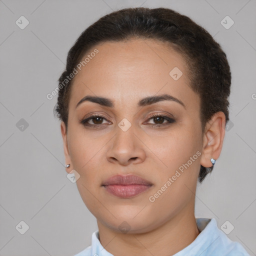 Joyful latino young-adult female with short  brown hair and brown eyes