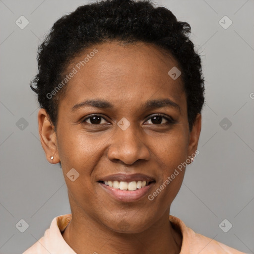 Joyful black young-adult female with short  black hair and brown eyes