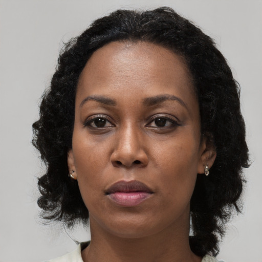 Neutral black young-adult female with medium  black hair and brown eyes