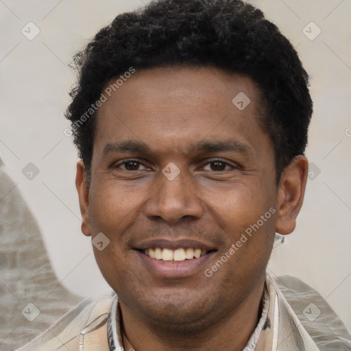 Joyful latino adult male with short  black hair and brown eyes