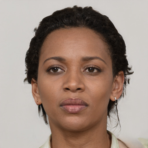 Neutral black young-adult female with short  black hair and brown eyes