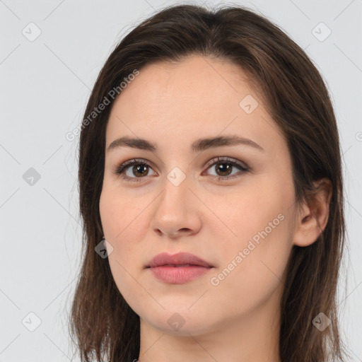 Neutral white young-adult female with long  brown hair and brown eyes