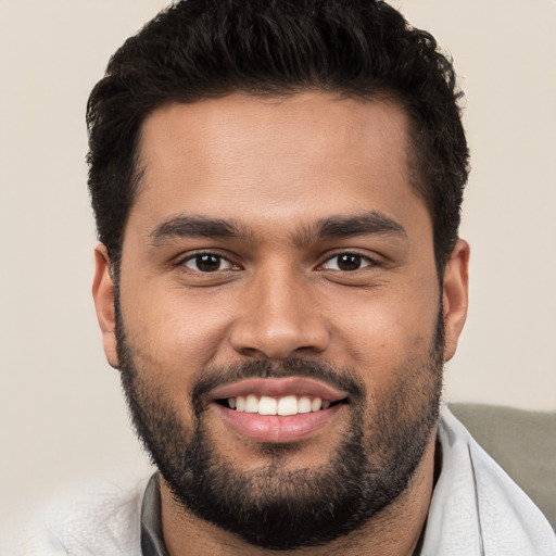 Joyful white young-adult male with short  black hair and brown eyes