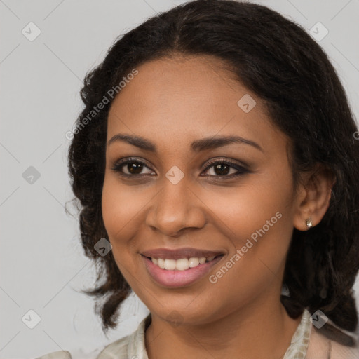 Joyful black young-adult female with medium  brown hair and brown eyes