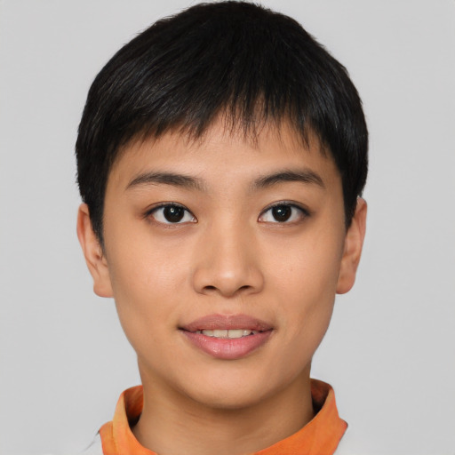 Joyful asian young-adult female with short  black hair and brown eyes