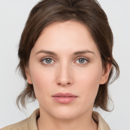 Neutral white young-adult female with medium  brown hair and grey eyes