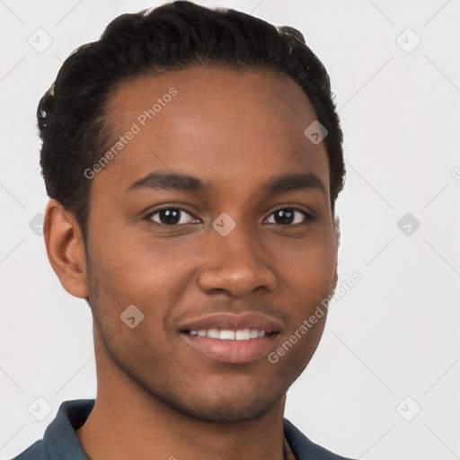 Joyful black young-adult male with short  brown hair and brown eyes