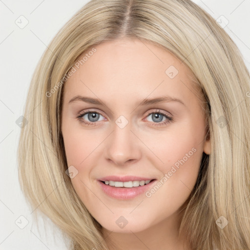 Joyful white young-adult female with long  brown hair and blue eyes